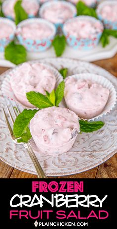 frozen cranberry fruit salad on a white plate with mint garnishes