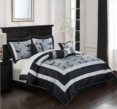 black and white comforter set with flowers on it