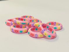 several rubber bracelets sitting on top of a table