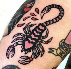 a man's arm with a scorpion tattoo on it, and the words i love you