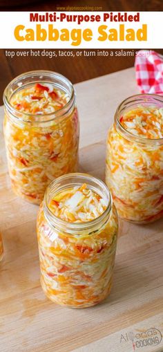 three jars filled with food sitting on top of a wooden cutting board