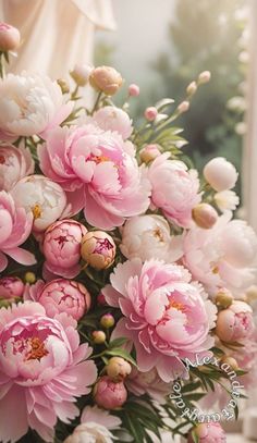 a bouquet of pink peonies in front of a window