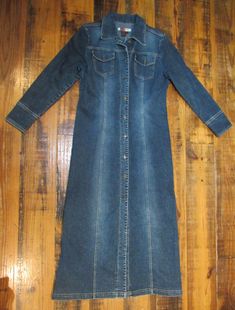 Awesome Y2K Denim Coat! It is in great shape with no flaws such as stains or holes. There is a small marking with a sharpie on the inside by the tag. Does not show through to the other side. Pit to Pit: 20" Pit to Sleeve: 16" Length (top of shoulder to bottom): 53" Fitted Collared Denim Jacket With Buttons, Fitted Collared Denim Jacket With Button Closure, Stretch Medium Wash Long Sleeve Outerwear, Fitted Button-up Denim Jacket For Winter, Fitted Dark Wash Collared Outerwear, Long Sleeve Fitted Denim Outerwear, Fitted Denim Jacket With Button Closure For Winter, Winter Fitted Denim Jacket With Button Closure, Fitted Long Sleeve Denim Outerwear