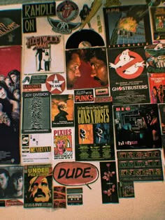 the wall is covered with posters and stickers