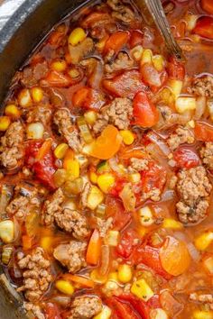 a large pot filled with meat and vegetables