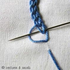 the crochet hook has been hooked up to an object that is being worked on