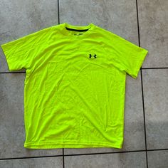 Never Worn. Neon Green/Yellow. Size Medium. Super Soft Yellow Sports Shirt For Summer, Yellow Summer Sports Shirt, Yellow Short Sleeve Streetwear Shirt, Yellow Sporty Shirt For Sports, Sporty Yellow Shirt For Sports, Casual Green Under Armour Top, Casual Neon Yellow Cotton T-shirt, Casual Neon Yellow Crew Neck Top, Casual Crew Neck Neon Yellow Top