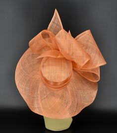 Elegant Orange Fascinator For Races, Elegant Orange Fascinator For Royal Ascot, Evening Boater Hat With Short Brim In Sinamay, Formal Sinamay Brimmed Boater Hat, Sinamay Boater Hat For Church And Royal Ascot, Beach Short Brim Sinamay Fascinator, Formal Adjustable Cloche Straw Hat, Adjustable Formal Straw Cloche Hat, Adjustable Cloche Straw Hat For Formal Occasions