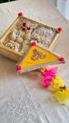 a small box filled with treats on top of a table