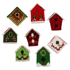 cross stitch birdhouses are arranged in a circle on a white background, each with different designs and colors