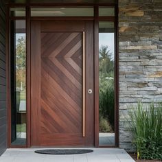 a modern wooden door in front of a house