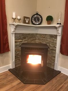 a fireplace with a clock on the mantle