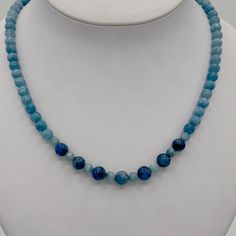 This is a Natural Gemstone Aquamarine Necklace with a mixture of different shades of blue. The beads are AAA quality, dark, medium and a lighter hue blend of aquamarine. Aquamarine is the March birthstone. This has a Sterling Silver lobster claw clasp and extender chain. It is adjustable from about 18-20”. Blue Kyanite Gemstone Bead Necklaces, Blue Kyanite Gemstone Beaded Necklace, Blue Kyanite Round Bead Jewelry, Blue Kyanite Gemstone Beads Jewelry, Blue Kyanite Jewelry With Gemstone Beads, Blue Kyanite Gemstone Necklace, Blue Aquamarine Single Strand Jewelry, Aquamarine Necklace With Natural Round Beads, Aquamarine Necklace With Round Natural Stone Beads