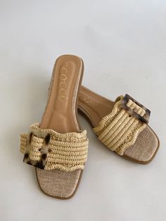 The Leslie Buckle Sandal offers effortless style with its flat slip-on design. The raffia strap adds a touch of texture, while the tortoise buckle detail adds a hint of sophistication. Perfect for any summer look, these sandals provide both comfort and fashion-forward appeal. Heel: 0.25" Vintage Havana, Buckle Sandals, Curvy Dress, Graphic Tops, Summer Look, Summer Looks, Tortoise, Effortless Style, Camel