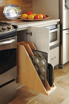 a kitchen with an oven, stove and dishwasher in the middle of it