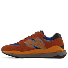 Looking for a sneaker that brings the best of both worlds? Check out the New Balance LIFESTYLE - 5740. This sneaker is a modern take on the vintage 574 silhouette, and it's built on a slimmer last for a more contemporary look. The upper is a combination of royal blue textile and rust-colored suede, with an oversized 'N' logo in cracked brown leather. The stack midsole provides lightweight cushioning in orange and grey, while the black rubber outsole features a modified tread inspired by the original road/trail traction pattern. (SNKR/Retro/Low Top) Balance Lifestyle, Blue Textile, Balanced Lifestyle, Black Rubber, The Vintage, Low Top, New Balance, Royal Blue, Brown Leather