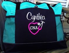 a black and blue tote bag with the words cupittia cna on it