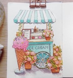 an ice cream cart with flowers on it