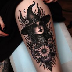 a woman's leg with flowers and a witch hat on her head is shown