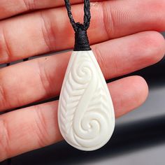 Natural Hand Carved Maori Bone Carving Pendant Necklace - Carved Patu With Binding Description: Stunning natural Kiwi Maori bone carving necklace, Patu carving with binding  Strung on braided black cord with adjustable sliding knots Please note: This product is listed on other platforms and there is a slight chance it could sell before we get time to take it off this platform - we will message alternatives or offer a refund in such event.  Please note, generic photos, variation will occur  Mater Wax Carving, Bone Pendant, Sliding Knot, Bone Carving, Jewelry Bags, Pendant Necklaces, Jewelry Necklace Pendant, Bones, Necklace Lengths