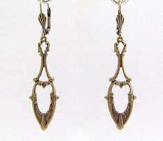 "Art Nouveau Earrings Antiqued golden brass Earrings. Fabulous long dangle Art Nouveau design earrings. Antiqued Brass, nickel free. Measure 2-1/4\" top to bottom. I am happy to switch to french ear wires or clip on if you prefer. Lever back design may vary. Dramatic Beauty...these can be worn every day to Wedding day! Sent to you with Aloha! More of my Artisan Jewelry: hawaiibeads.etsy.com" Formal Brass Bridal Earrings For Pierced Ears, Formal Brass Bridal Earrings, Victorian Gold Chandelier Earrings In Brass, Formal Brass Dangle Plug Earrings, Brass Plug Earrings For Wedding, Formal Brass Dangle Chandelier Earrings, Antique Gold Chandelier Earrings In Brass, Art Nouveau Gold Earrings For Wedding, Gold Art Nouveau Earrings For Weddings