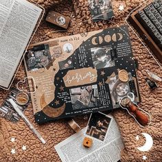 an open book on top of a brown blanket next to other items and bookshelves