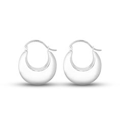 These stylish puff hoop earrings are crafted in classic sterling silver buffed to a polished luster. Measuring 28x23mm, the earrings secure with hinged backs. Sterling Silver Jewelry With Smooth Finish, Round Sterling Silver Jewelry With Smooth Finish, Silver Jewelry With Smooth Finish And Round Shape, Elegant Sterling Silver Rounded Earrings, Elegant Rounded Sterling Silver Earrings, Sterling Silver Hoop Earrings With Shiny Finish, Elegant Silver Crescent Hoop Earrings, Classic Hinged Earrings For Everyday, Classic Hinged Sterling Silver Jewelry