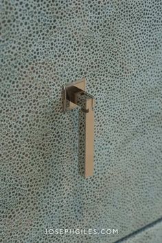 a close up of a metal handle on a wall