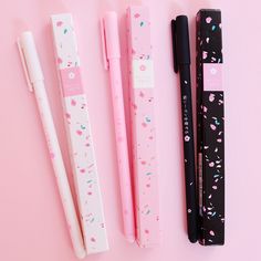 three pens are lined up next to each other on a pink surface with the words my kawaicraftate com