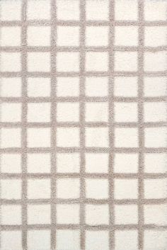 a white rug with squares on it