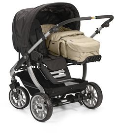 a baby stroller with an infant seat on it's back and side wheels