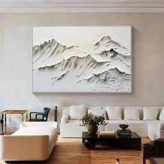 a living room filled with furniture and a painting on the wall