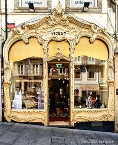 an old fashion store front with mannequins in the window