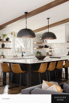 a large kitchen island with lots of chairs around it