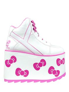 Introducing YRU's Qozmo featuring the iconic Hello Kitty Bow. This platform lace-up shoe has a white vegan leather upper and details, and an embroidered Hello Kitty design. The white tricot lining and white vegan leather wrapped EVA bottom with printed Bows add to its appeal. It stands tall on a 3 inch pink rubber outsold platform and 4 inch heel. Pink Platform Boots, Yru Shoes, Pink Goth, Kawaii Pastel Goth, Hello Kitty Bow, Goth Shoes, Pink Platform, Pink Platforms, Hello Kitty Collection