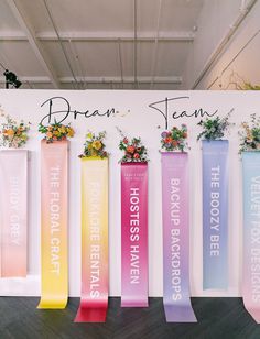 a group of colorful banners with flowers on them