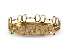 a gold bracelet with metal links and letters on the inside, in front of a white background