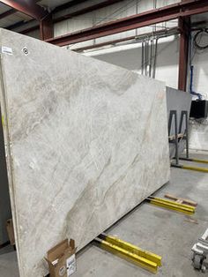 a large white marble slab in a warehouse