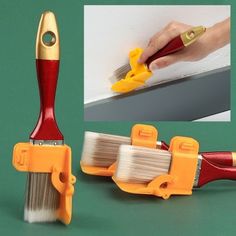 a close up of a brush and paint roller on a green surface with an image of a hand holding a yellow handle