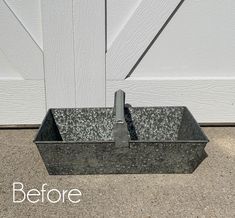 a metal container sitting on the ground next to a white door with words before and after