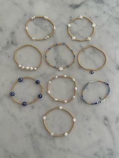 Bracelet Inspo Preppy, Preppy Gold Bracelet, Where To Buy Bracelets, Blue And Gold Beaded Bracelets, Preppy Gold Bracelet Stack, Perment Jewelry, Gold And Blue Bracelet, Bracelet Ideas Aesthetic Beaded, Cute Trendy Bracelets