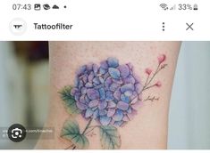 a flower tattoo is shown on the leg