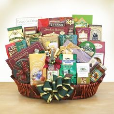 a large gift basket filled with chocolates, candy and candies on a table