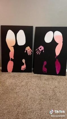 two canvases with hand prints on them