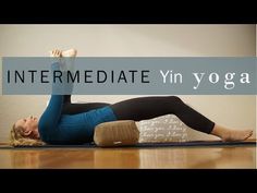 a woman laying on her stomach with the words intermediae yin yoga in front of her