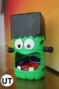 the halloween candy holder is made to look like a monster