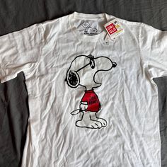 Please Note This Is New With Tags, But There Is Some Minor Yellowing On The Inner Collar. Please Note It Is Not From Wear. Casual Relaxed Fit Shirt With Cartoon Print, Relaxed Fit Cotton Tops With Cartoon Print, Relaxed Fit Cotton Top With Cartoon Print, Cotton Tops With Cartoon Print In Relaxed Fit, Kaws Snoopy, Kaws White, Heart Tee Shirt, Uniqlo Shirt, Vintage Snoopy