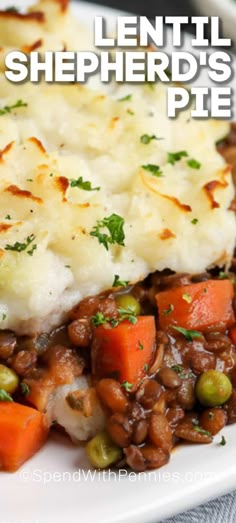 a white plate topped with mashed potatoes and peas