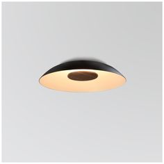 a black and white light hanging from the ceiling