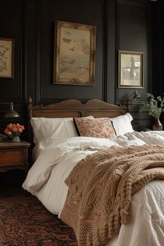 a large bed sitting in a bedroom next to a wooden headboard and foot board